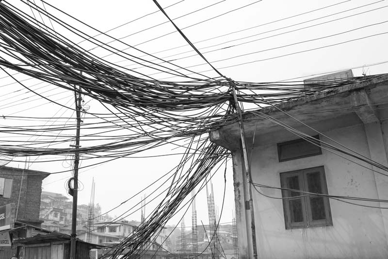 Water cables hanging untidily over and between buildings in Kohima, Nagaland, imparting an ugly look to the picturesque hill city